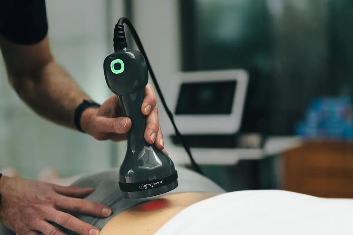 LightForce therapy laser in use in a rehabilitation practice