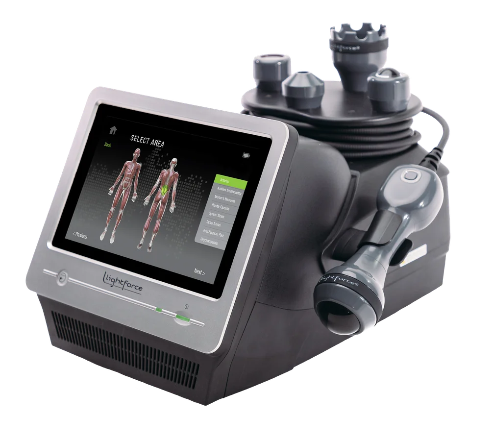 LightForce XPi laser console with handpiece and treatment heads